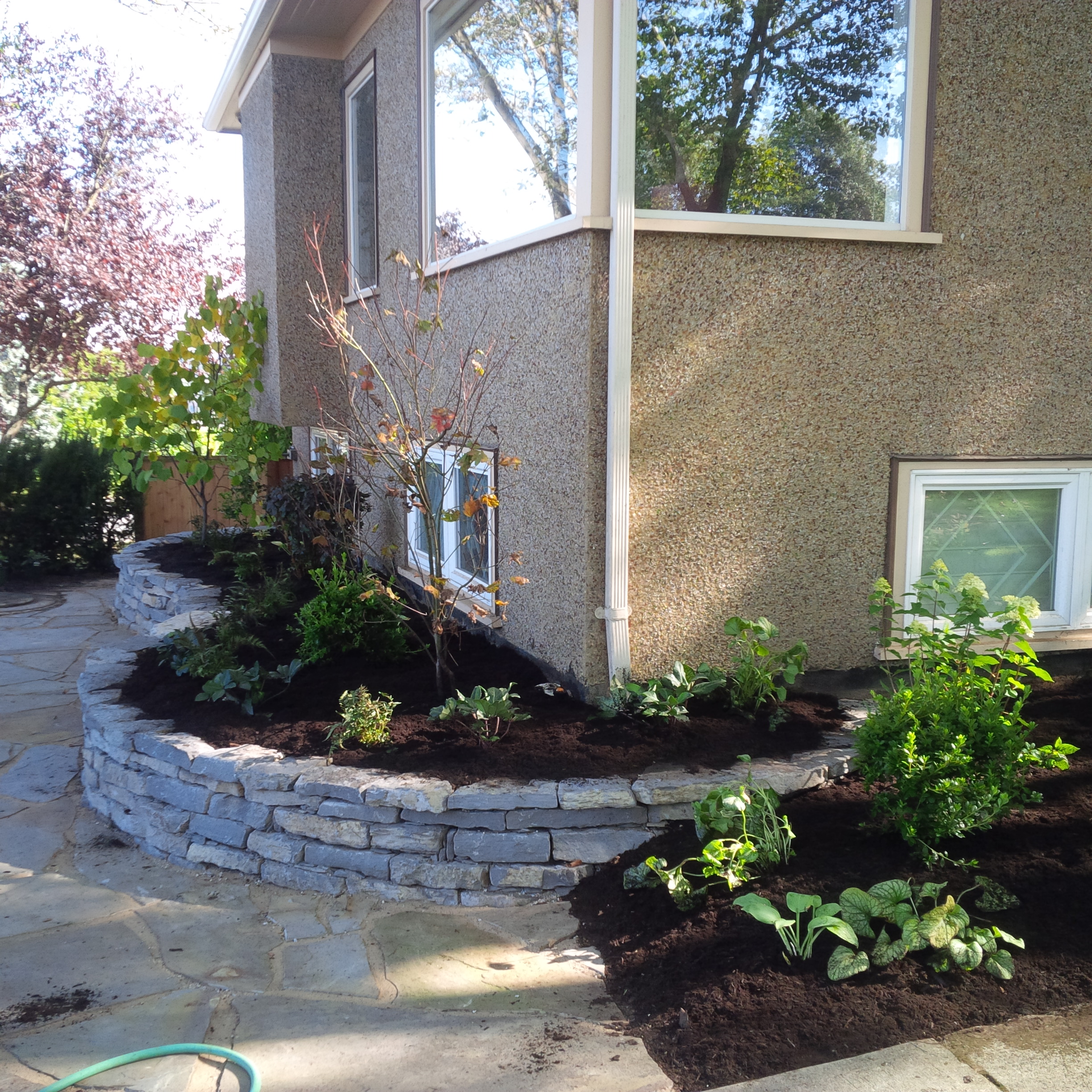 dry stone raised garden bed landscape construction vancouver bc